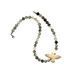 A smoky quartz necklace with a ceramic dove bird
