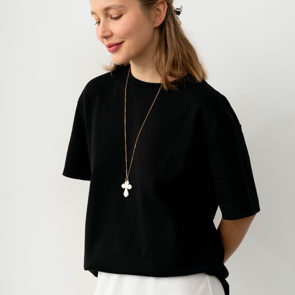 Ceramic cross pendant on a long chain