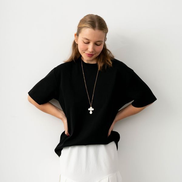 Ceramic cross pendant on a long chain