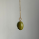 Olive-shaped bead on a chain with gold-tone hardware